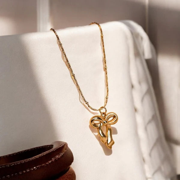 Aureline – Infinite Grace Bow Pendant
