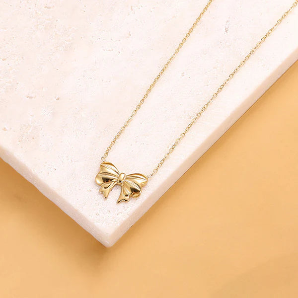 Bellaria – Golden Bow Whisper Pendant