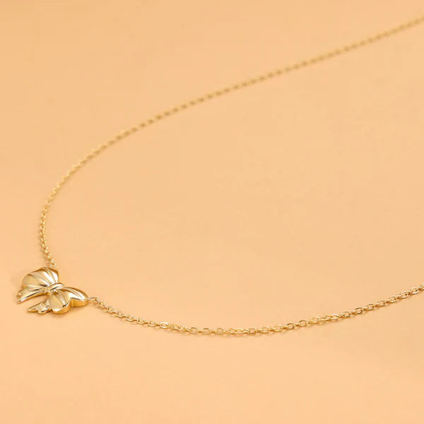 Bellaria – Golden Bow Whisper Pendant