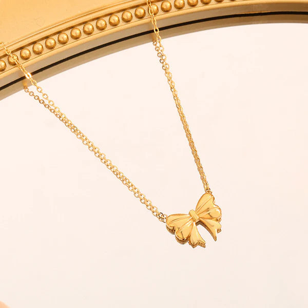 Bellaria – Golden Bow Whisper Pendant