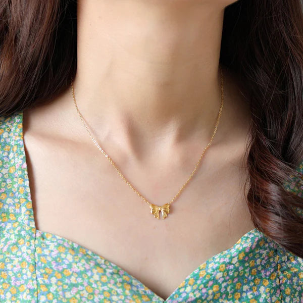 Bellaria – Golden Bow Whisper Pendant