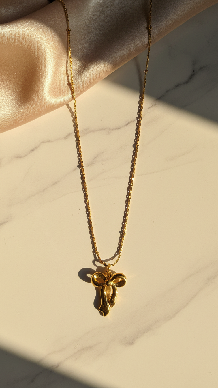 Aureline – Infinite Grace Bow Pendant